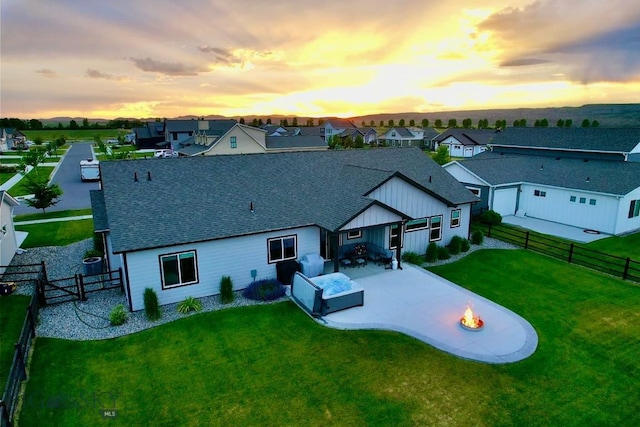176 Travelers, Manhattan, MT 59741 - rear view of property with a patio area, a fenced backyard, roof with shingles, and a residential view