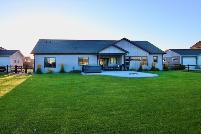 176 Travelers, Manhattan, MT 59741 - back of house with a patio area, a fenced backyard, and board and batten siding