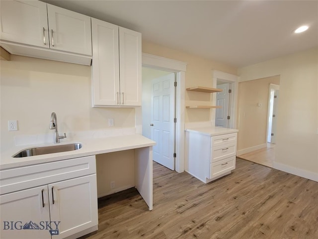 1043 W Galena St, Butte, MT 59701 - kitchen featuring open shelves, light wood finished floors, white cabinetry, light countertops, and recessed lighting