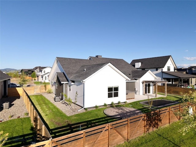 1991 Ryun Sun Way, Bozeman, MT 59718 - rear view of property featuring a fenced backyard, a residential view, a shingled roof, and a pergola