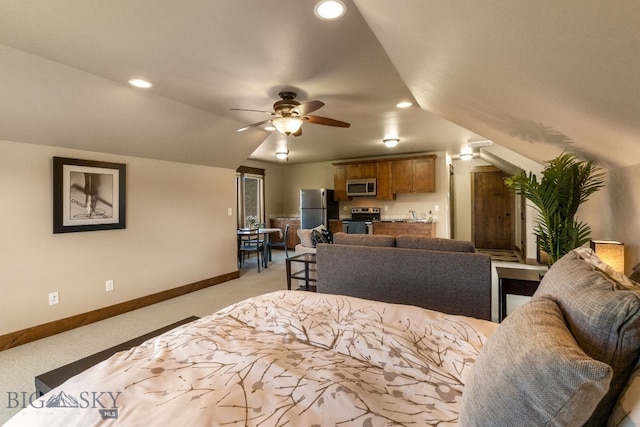 2497 Northview, Bozeman, MT 59715 - bedroom featuring freestanding refrigerator, light colored carpet, lofted ceiling, and recessed lighting