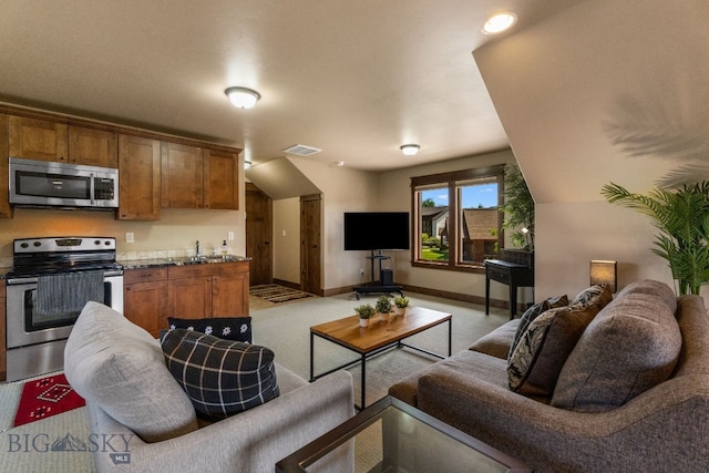 2497 Northview, Bozeman, MT 59715 - living room featuring baseboards and light colored carpet