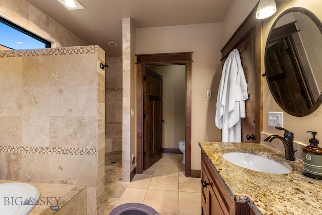 2497 Northview, Bozeman, MT 59715 - bathroom featuring a walk in shower, vanity, a garden tub, and tile patterned flooring