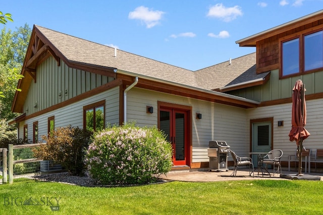 2497 Northview, Bozeman, MT 59715 - rear view of house with board and batten siding, a patio area, and a shingled roof