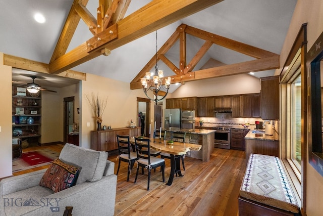 2497 Northview, Bozeman, MT 59715 - dining space with high vaulted ceiling, a chandelier, light wood finished floors, beam ceiling, and a ceiling fan