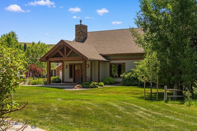 2497 Northview, Bozeman, MT 59715 - view of front of property with a front lawn, a chimney, and a shingled roof