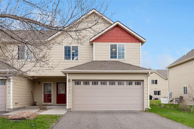 1030 N River Rock St, Belgrade, MT 59714 - view of front of property with driveway and an attached garage