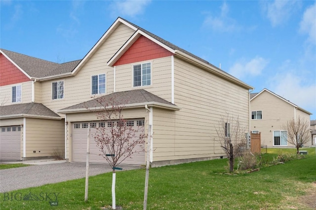 1030 N River Rock St, Belgrade, MT 59714 - view of property exterior featuring a garage, driveway, and a lawn