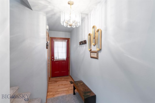 1030 N River Rock St, Belgrade, MT 59714 - doorway with a chandelier, light wood-type flooring, and stairs