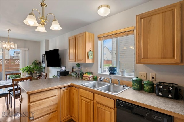 1030 N River Rock St, Belgrade, MT 59714 - kitchen with a chandelier, dishwasher, a peninsula, pendant lighting, and light countertops