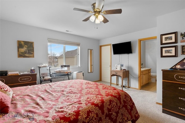 1030 N River Rock St, Belgrade, MT 59714 - bedroom with light colored carpet, ceiling fan, and ensuite bath