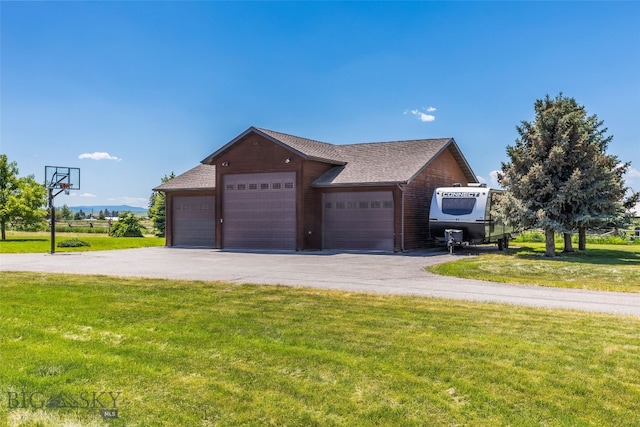 164 Wapiti Way, Bozeman, MT 59718 - view of side of home featuring a yard, a detached garage, and a shingled roof