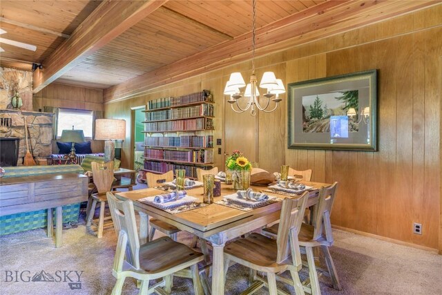 100 Nez Perce Rd, Butte, MT 59701 - dining area with wooden walls, a chandelier, carpet floors, and a wooden ceiling with exposed beams
