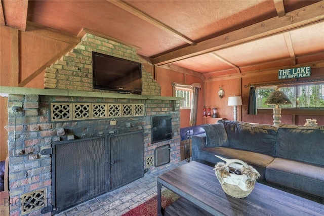 100 Nez Perce Rd, Butte, MT 59701 - living area featuring a brick fireplace, brick patterned floors, wood walls, and beamed ceiling