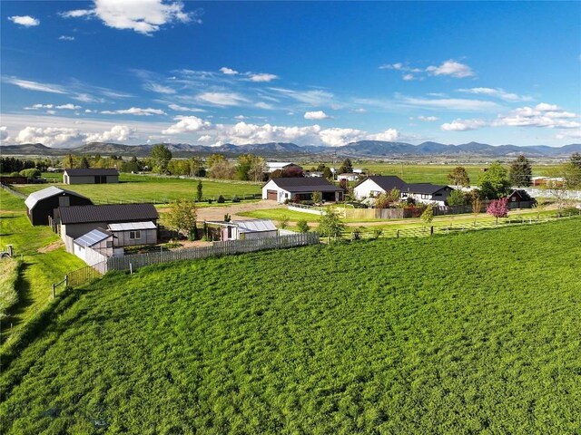 3950 Floweree, Helena, MT 59602 - fenced backyard featuring a mountain view and an outbuilding