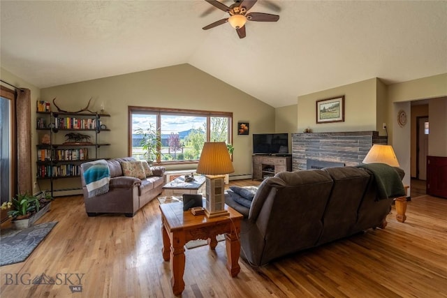 3950 Floweree, Helena, MT 59602 - living area featuring ceiling fan, a fireplace, wood finished floors, lofted ceiling, and a baseboard heating unit