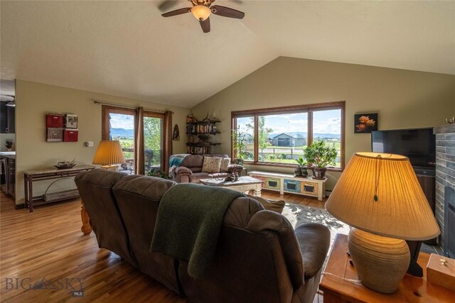 3950 Floweree, Helena, MT 59602 - living room with wood finished floors, vaulted ceiling, and a ceiling fan