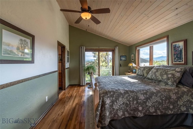 3950 Floweree, Helena, MT 59602 - bedroom featuring wooden ceiling, lofted ceiling, multiple windows, wood finished floors, and access to exterior