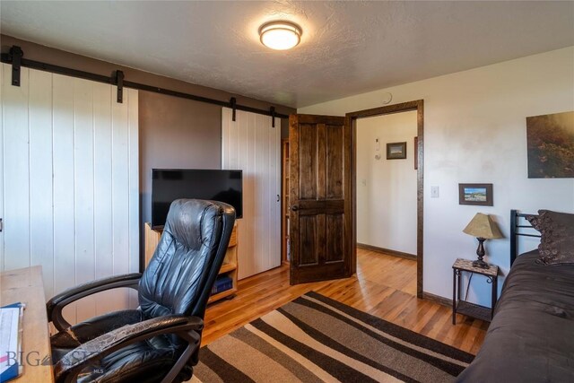 3950 Floweree, Helena, MT 59602 - office area featuring a barn door and light wood-type flooring