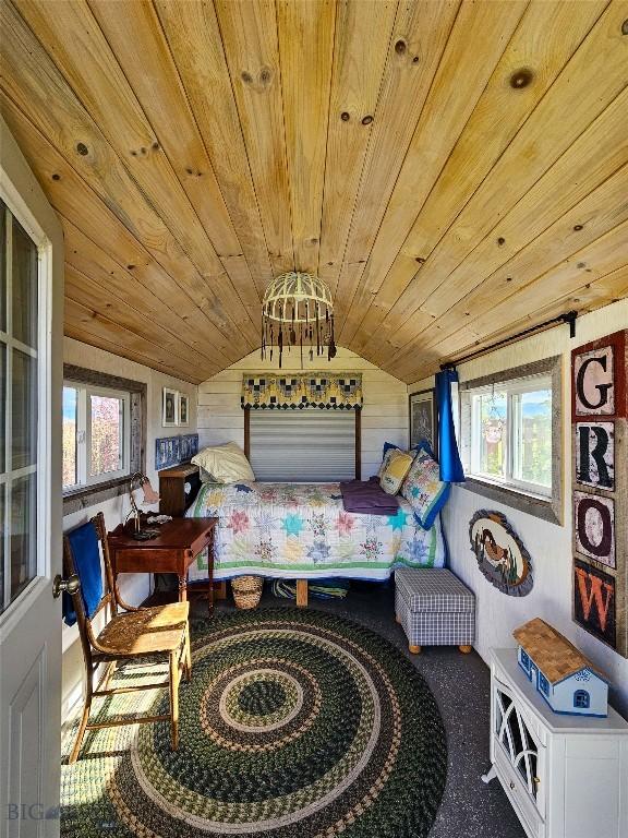 3950 Floweree, Helena, MT 59602 - carpeted bedroom with wood ceiling, lofted ceiling, and wooden walls