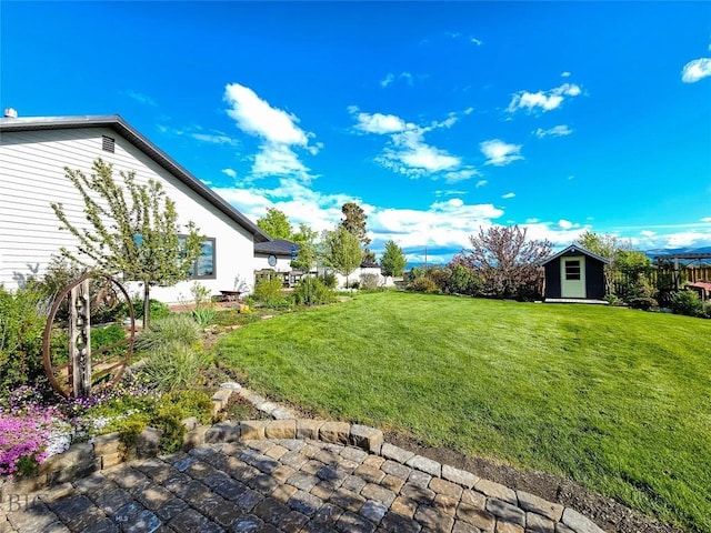 3950 Floweree, Helena, MT 59602 - view of grassy yard featuring a storage unit