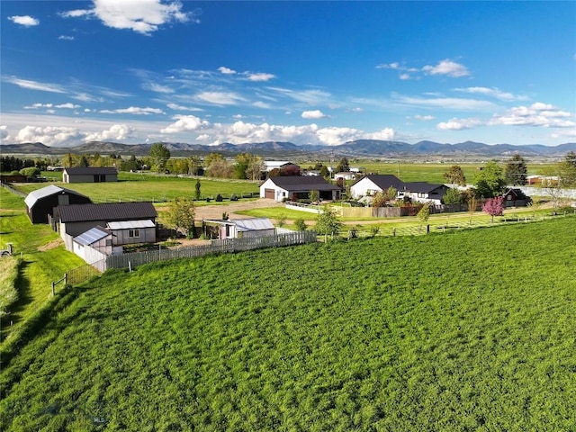 3950 Floweree, Helena, MT 59602 - fenced backyard featuring a mountain view and an outbuilding