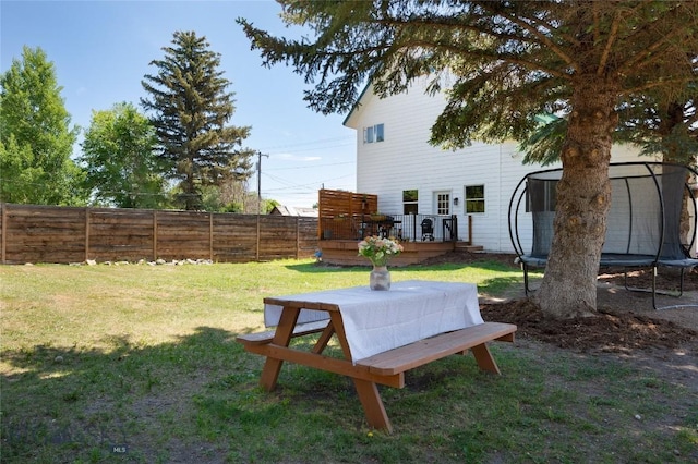 219 W Adams, Three Forks, MT 59752 - view of yard with a trampoline and a wooden deck