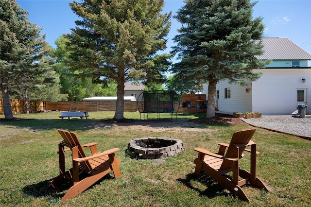 219 W Adams, Three Forks, MT 59752 - view of yard with a trampoline and an outdoor fire pit