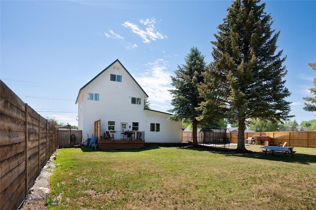 219 W Adams, Three Forks, MT 59752 - rear view of house with a wooden deck and a fenced backyard