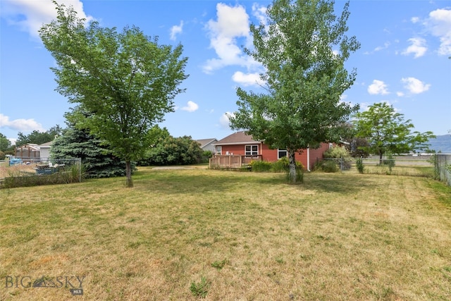 1002 E Northern Pacific Ave, Belgrade, MT 59714 - view of yard featuring a wooden deck