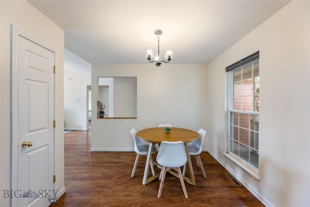 1002 E Northern Pacific Ave, Belgrade, MT 59714 - dining space with a chandelier and wood finished floors