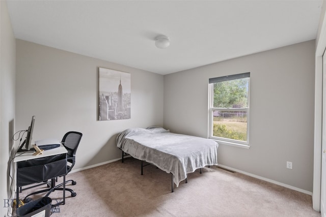 1002 E Northern Pacific Ave, Belgrade, MT 59714 - carpeted bedroom with baseboards and an office area