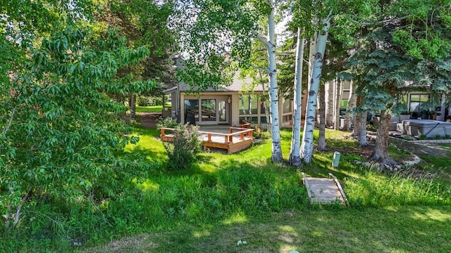 8A Gallatin Dr, Bozeman, MT 59718 - view of green lawn with a deck