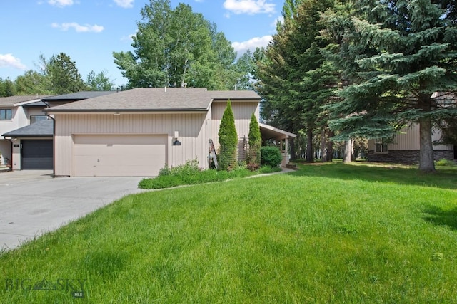 8A Gallatin Dr, Bozeman, MT 59718 - view of home's exterior featuring a garage, a yard, concrete driveway, and a shingled roof
