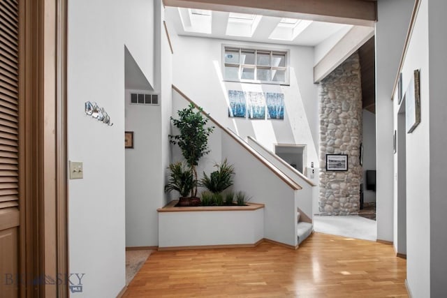 8A Gallatin Dr, Bozeman, MT 59718 - entryway with wood finished floors, stairway, and a skylight