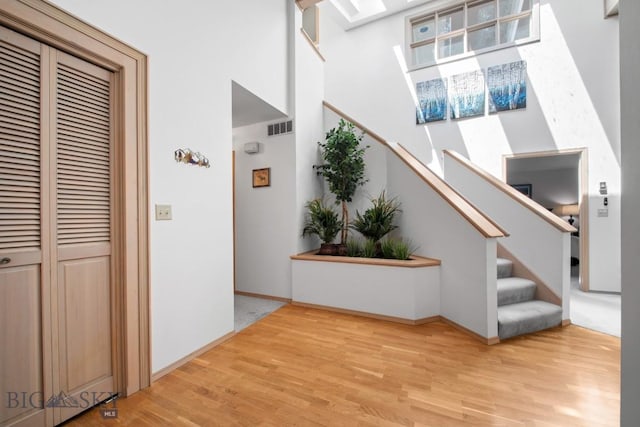 8A Gallatin Dr, Bozeman, MT 59718 - interior space featuring wood finished floors, a towering ceiling, and stairs