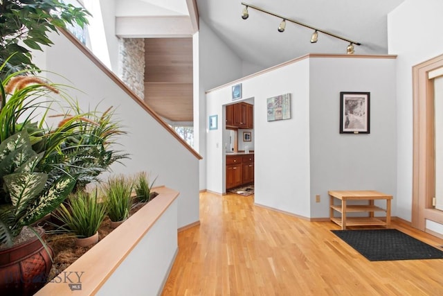 8A Gallatin Dr, Bozeman, MT 59718 - entryway featuring rail lighting, light wood-style flooring, high vaulted ceiling, and stairway