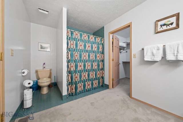 8A Gallatin Dr, Bozeman, MT 59718 - full bath featuring a shower with curtain and a textured ceiling
