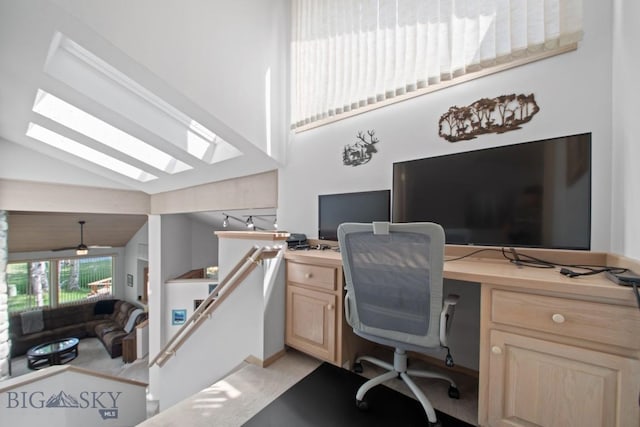 8A Gallatin Dr, Bozeman, MT 59718 - office space featuring vaulted ceiling, a skylight, light carpet, and ceiling fan