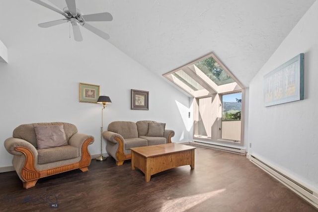 8A Gallatin Dr, Bozeman, MT 59718 - living room featuring baseboard heating, lofted ceiling, a skylight, dark wood-type flooring, and a ceiling fan