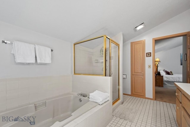 8A Gallatin Dr, Bozeman, MT 59718 - ensuite bathroom featuring lofted ceiling, a bath, a shower stall, tile patterned floors, and vanity