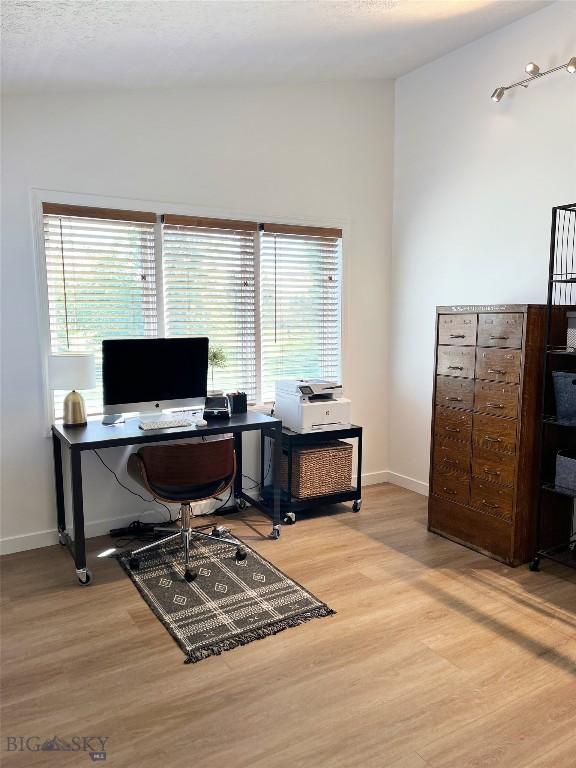 3575 Stucky Rd, Bozeman, MT 59715 - home office with wood finished floors and healthy amount of natural light