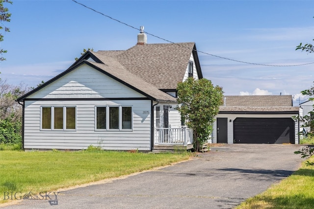 3575 Stucky Rd, Bozeman, MT 59715 - view of front facade with asphalt driveway, a chimney, a shingled roof, and an attached garage