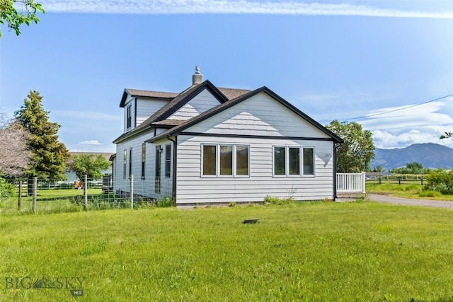 3575 Stucky Rd, Bozeman, MT 59715 - back of property featuring a chimney and a mountain view
