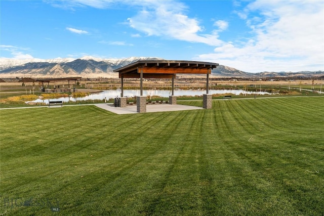 608 Mira Way Unit A, Belgrade, MT 59714 - view of green lawn featuring a water and mountain view