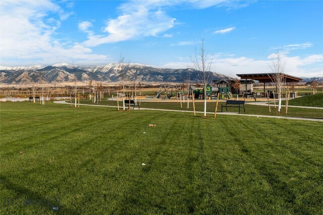 608 Mira Way Unit A, Belgrade, MT 59714 - view of grassy yard featuring a mountain view
