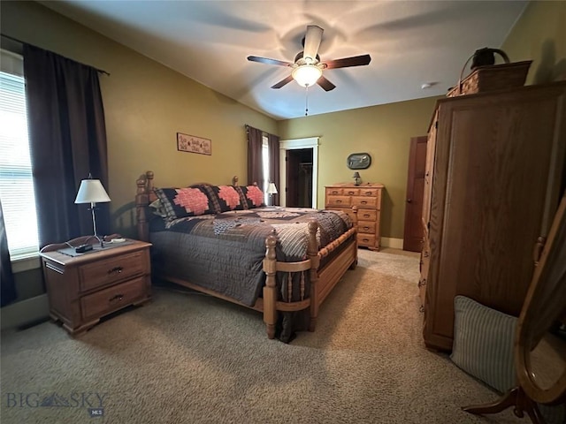 64 Mountain View Trl, White Sulphur Springs, MT 59645 - bedroom with multiple windows, light carpet, a ceiling fan, and a walk in closet