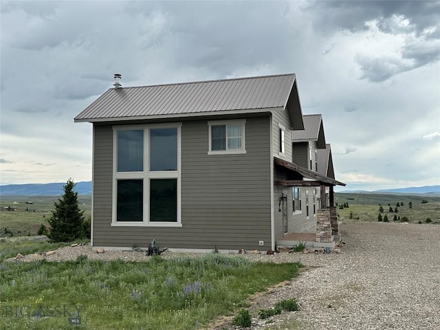 64 Mountain View Trl, White Sulphur Springs, MT 59645 - view of property exterior featuring a mountain view and a metal roof