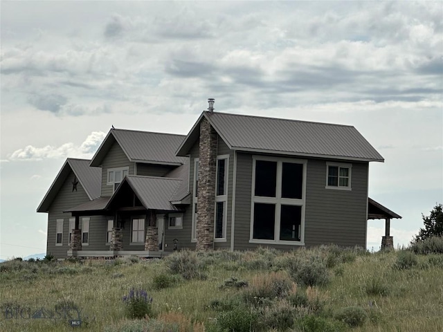 64 Mountain View Trl, White Sulphur Springs, MT 59645 - view of front of home with stone siding and a metal roof