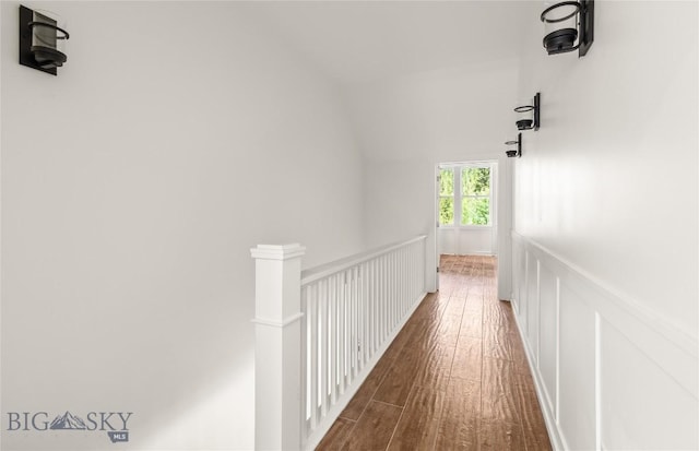 189 Blue Creek Rd, Heron, MT 59844 - hall with wood finished floors, a wainscoted wall, a decorative wall, and an upstairs landing